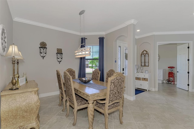 dining area with light tile patterned floors and crown molding