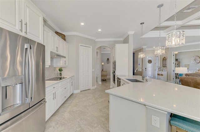 kitchen featuring sink, white cabinetry, crown molding, hanging light fixtures, and appliances with stainless steel finishes