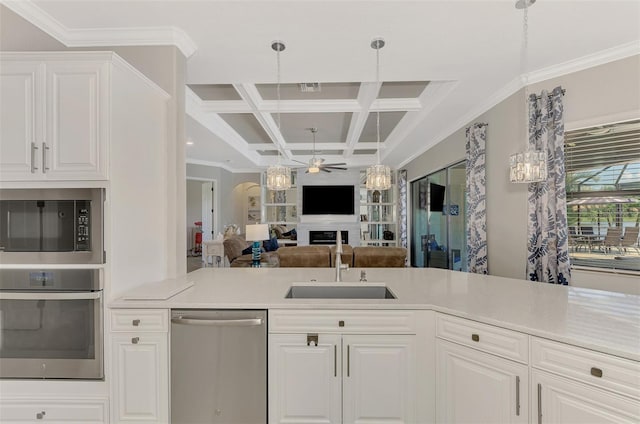 kitchen featuring coffered ceiling, sink, white cabinets, and appliances with stainless steel finishes