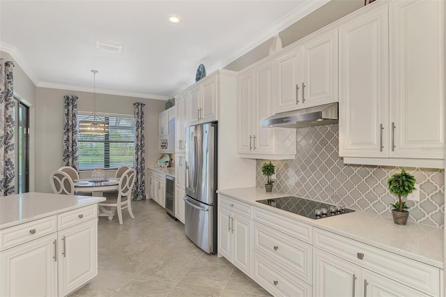 kitchen with white cabinets, stainless steel fridge, hanging light fixtures, ornamental molding, and black electric cooktop