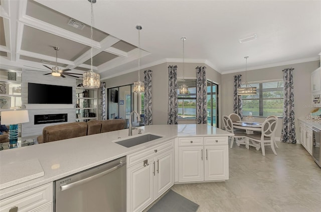 kitchen with dishwasher, a large fireplace, sink, white cabinets, and coffered ceiling