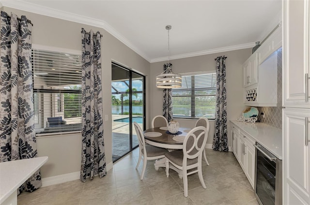 dining room featuring ornamental molding, light tile patterned floors, and beverage cooler