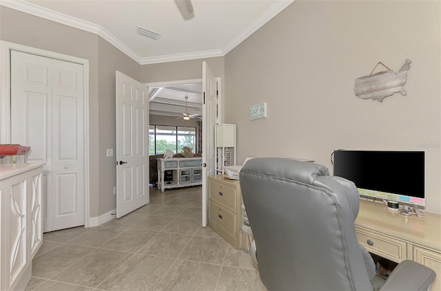 office space featuring crown molding, ceiling fan, and light tile patterned flooring