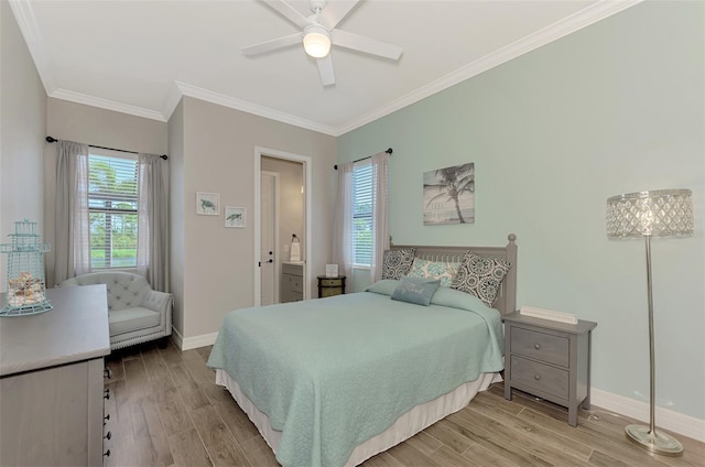 bedroom featuring crown molding, ceiling fan, and light wood-type flooring