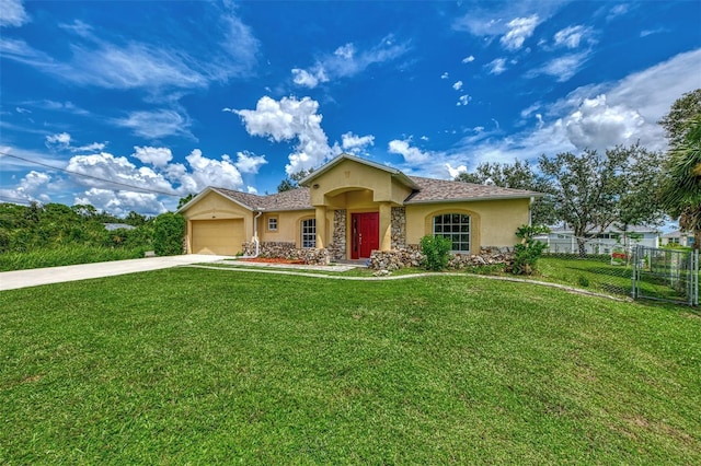 view of front facade with a garage, fence, driveway, stucco siding, and a front lawn