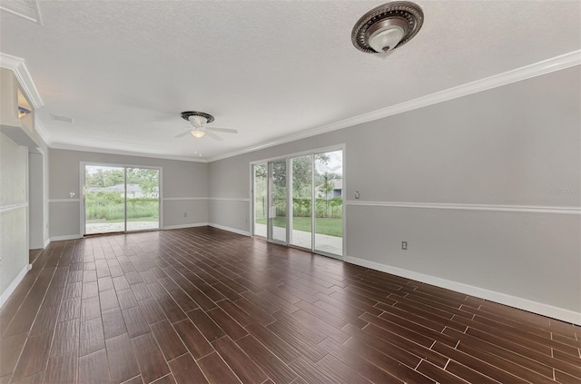 spare room featuring crown molding, plenty of natural light, and ceiling fan