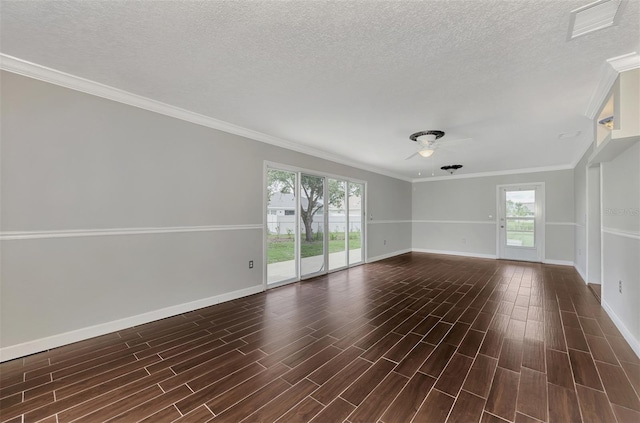 unfurnished room with dark wood-style floors, visible vents, ceiling fan, a textured ceiling, and baseboards