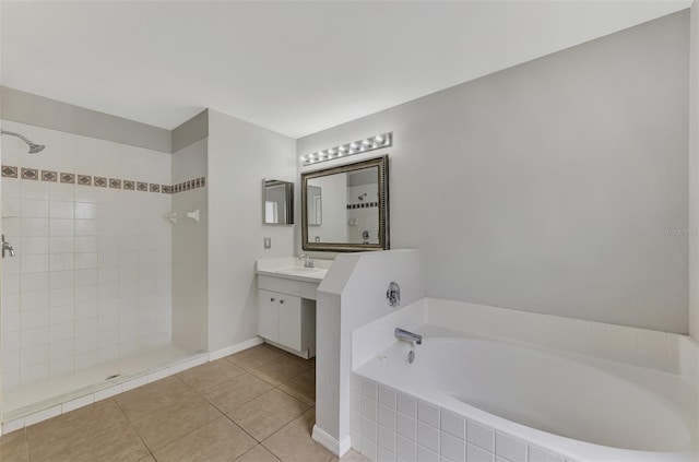 bathroom featuring tile patterned flooring, shower with separate bathtub, and vanity