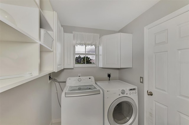 clothes washing area with separate washer and dryer