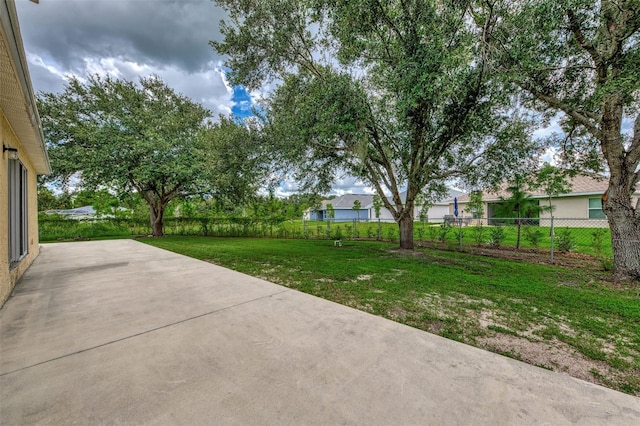 view of yard with a patio area and fence