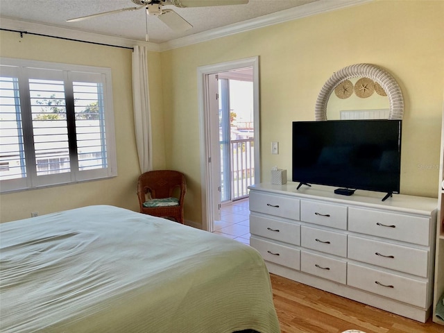 bedroom with ceiling fan, ornamental molding, multiple windows, and access to outside