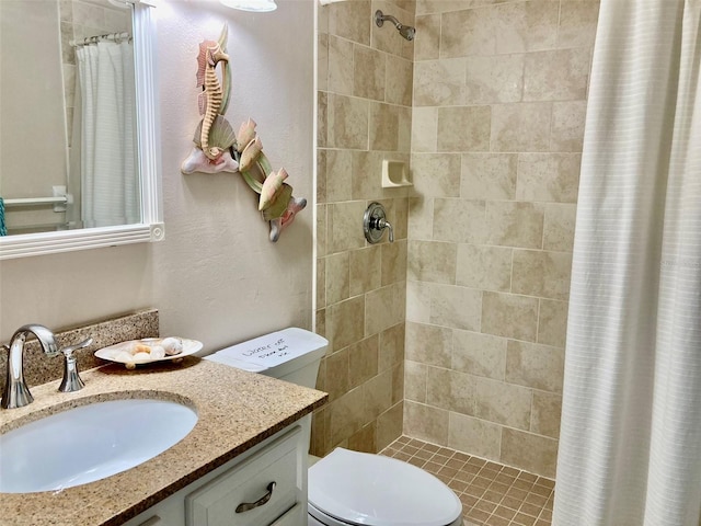 bathroom with toilet, vanity, and a shower with shower curtain