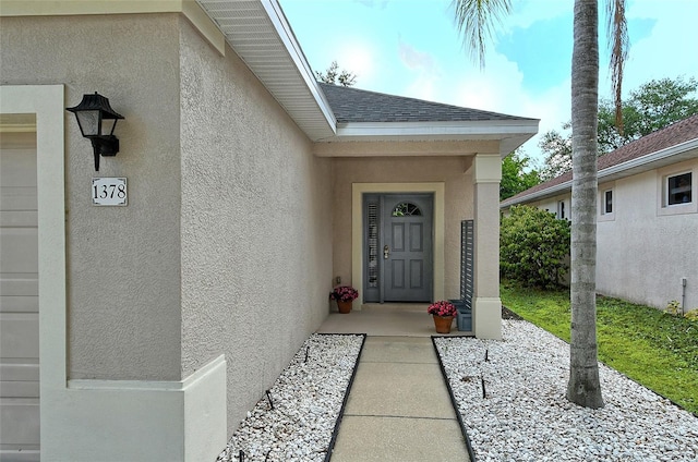 property entrance with a garage