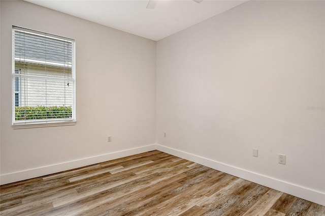 unfurnished room featuring wood-type flooring and ceiling fan