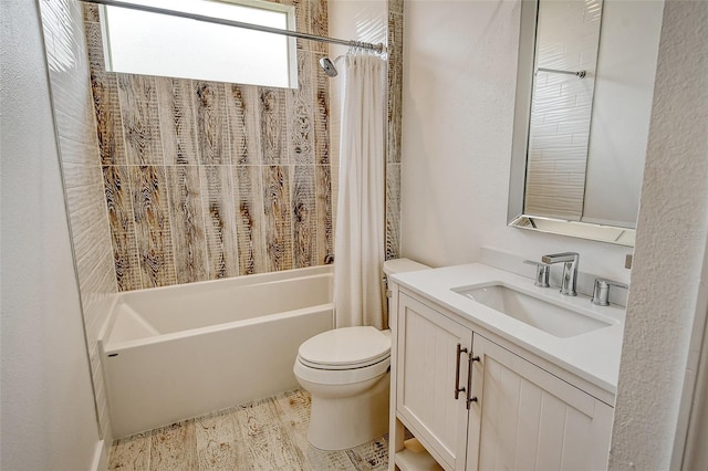 full bathroom featuring toilet, vanity, and shower / bathtub combination with curtain