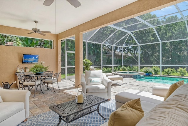 view of patio with a swimming pool with hot tub, an outdoor living space, and a lanai