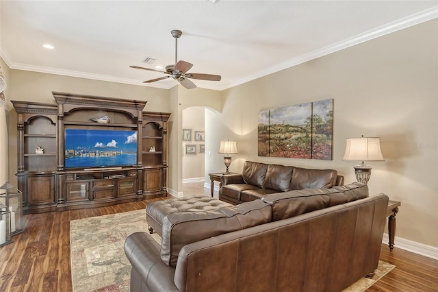 living room featuring crown molding, ceiling fan, and dark hardwood / wood-style flooring