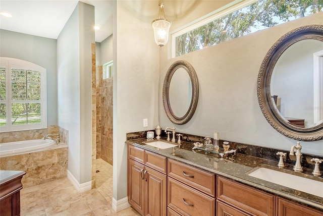 bathroom with vanity and plus walk in shower