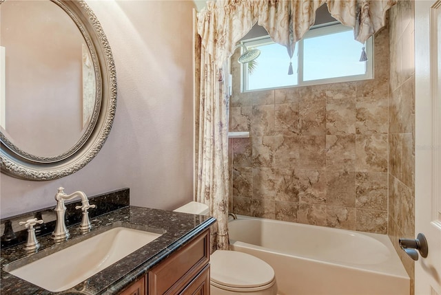 full bathroom with vanity, shower / bath combination with curtain, and toilet