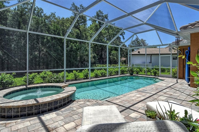 view of swimming pool featuring a lanai, a patio, and an in ground hot tub