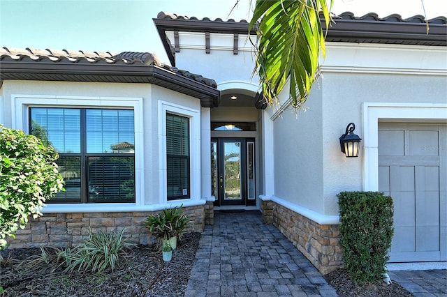 property entrance with a garage