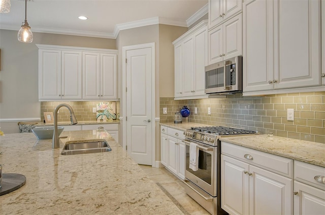 kitchen featuring sink, white cabinets, and appliances with stainless steel finishes