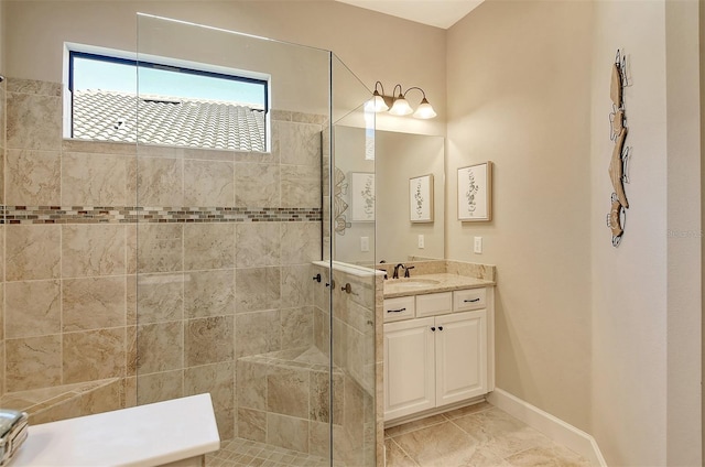 bathroom with vanity, tile patterned floors, and a tile shower