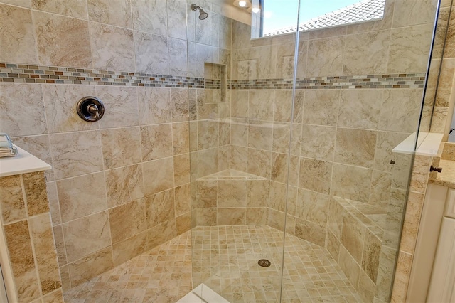 bathroom with a tile shower