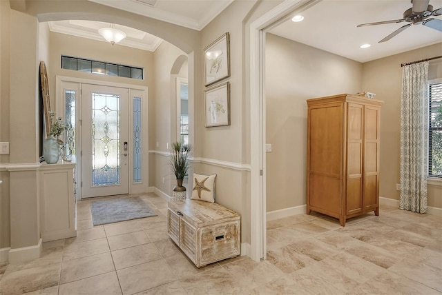 foyer featuring crown molding and ceiling fan