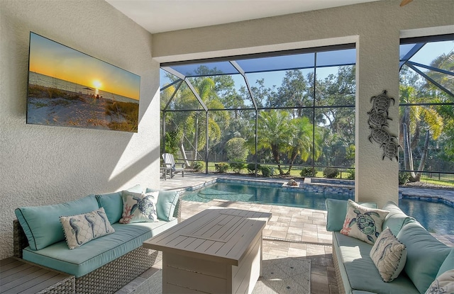 view of pool with an outdoor living space, a lanai, and a patio