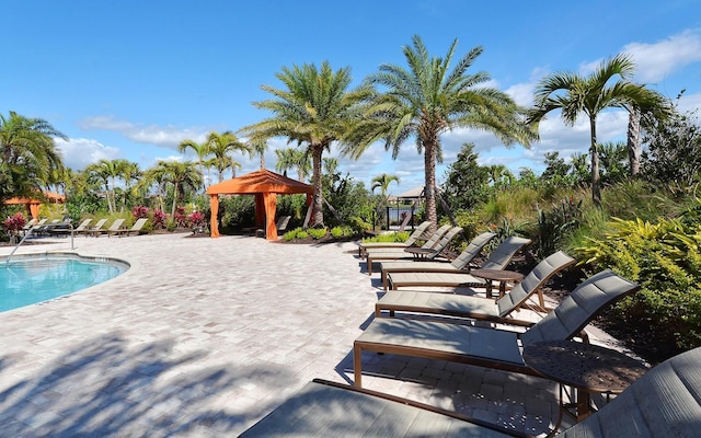 view of swimming pool with a gazebo and a patio area