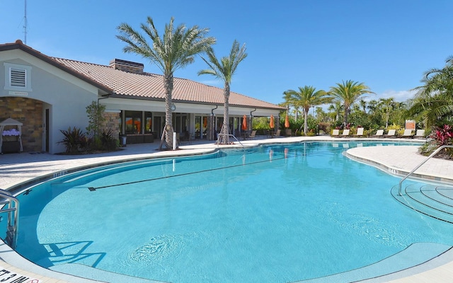 view of swimming pool with a patio area