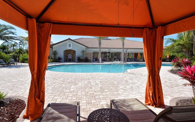 view of pool with a gazebo and a patio area