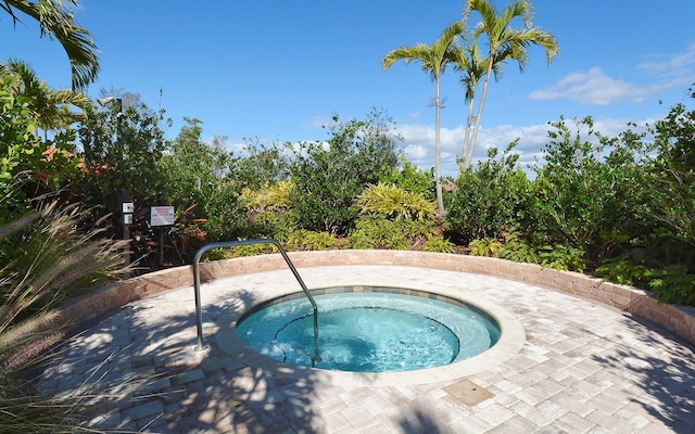 view of pool featuring a hot tub