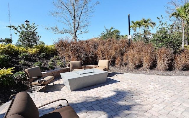 view of patio with a fire pit