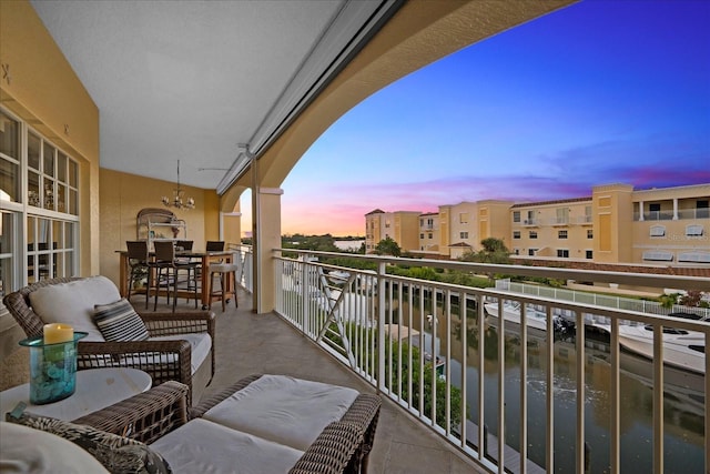 balcony at dusk with a water view