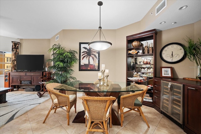 tiled dining room featuring wine cooler