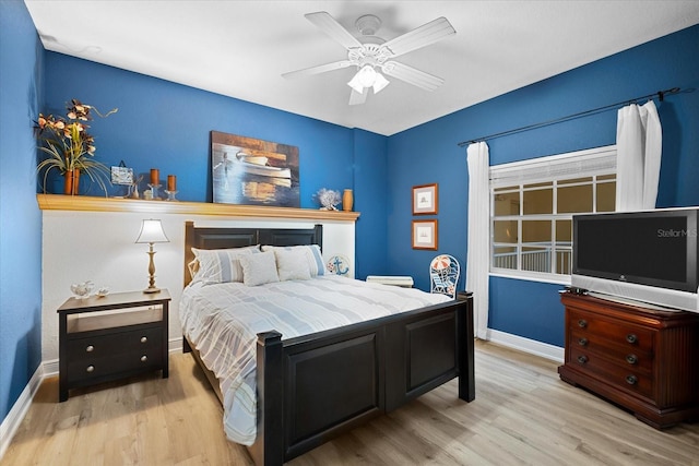 bedroom featuring ceiling fan and light hardwood / wood-style flooring