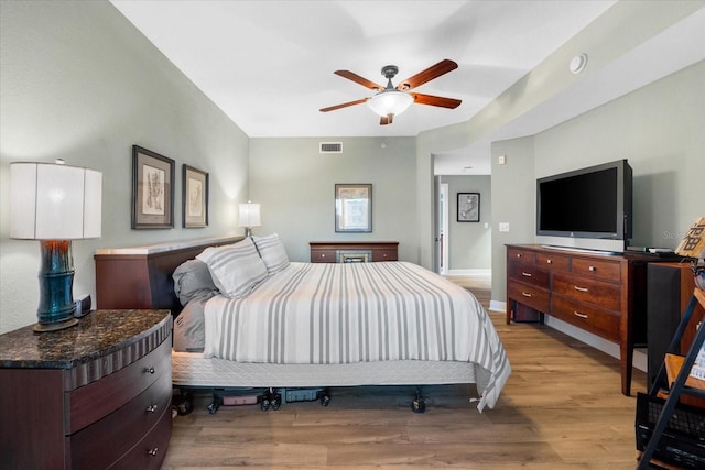 bedroom featuring light wood-type flooring and ceiling fan