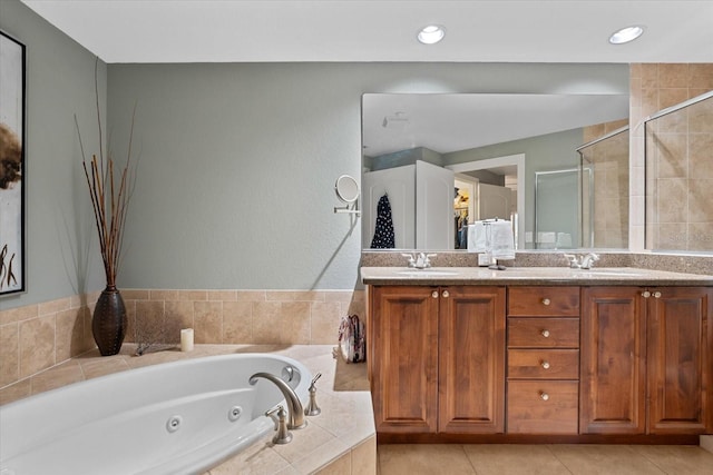 bathroom with plus walk in shower, vanity, and tile patterned floors