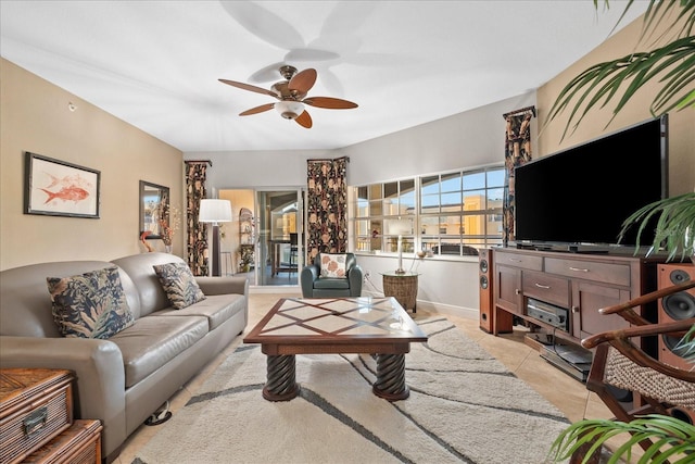 living room featuring ceiling fan and light tile patterned floors