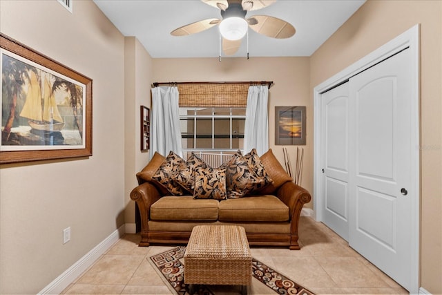 living room with light tile patterned floors and ceiling fan