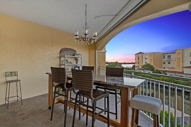 view of balcony at dusk