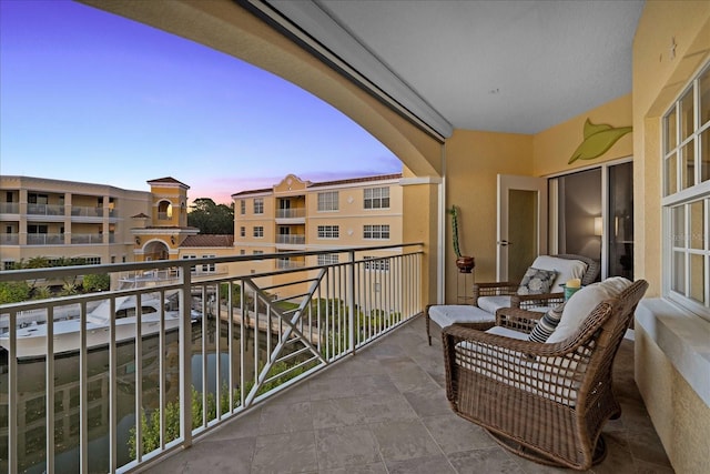 view of balcony at dusk