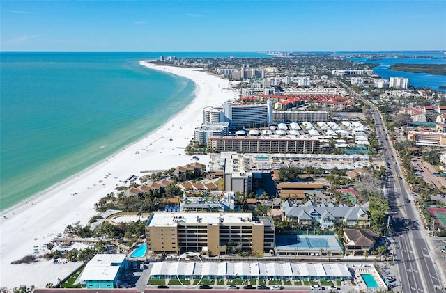 bird's eye view featuring a water view and a view of the beach