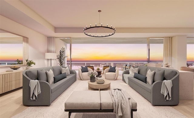 living room with hardwood / wood-style flooring and a notable chandelier