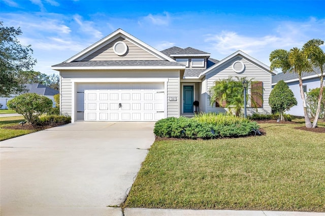 view of front facade with a garage and a front yard