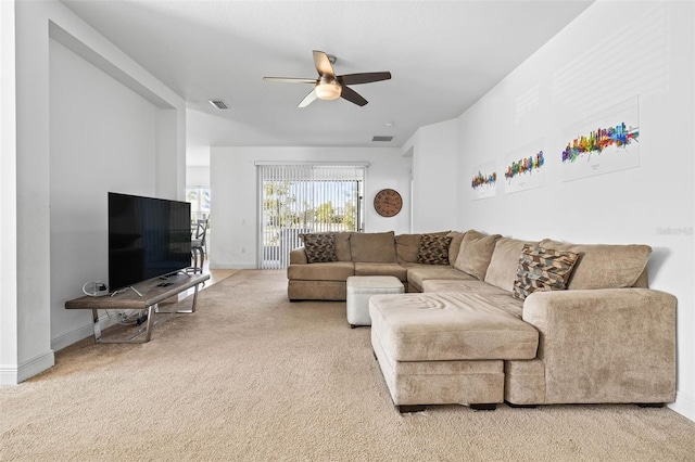 living room featuring carpet floors and ceiling fan