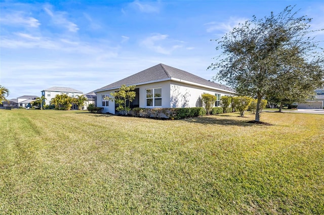 view of property exterior with a yard