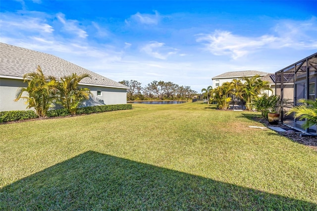 view of yard with a lanai